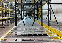 How does wire mesh decking for pallet racking help companies save money?
